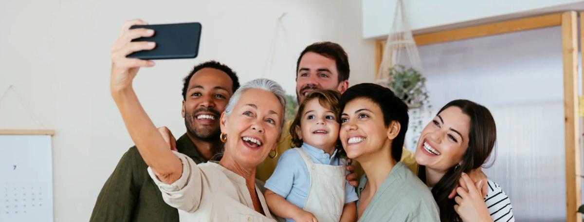 Diverse group of adults and children smiling together