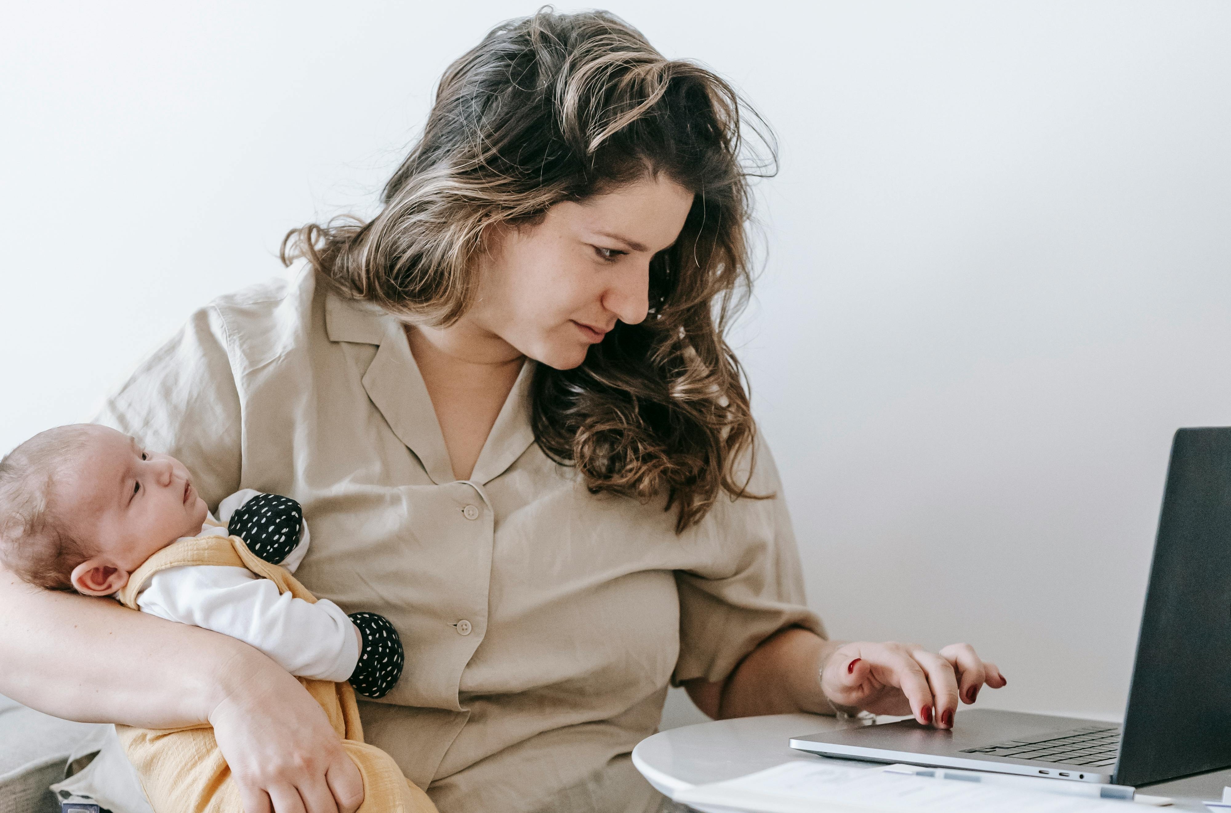 Parent helping child set up their first email account with safety settings